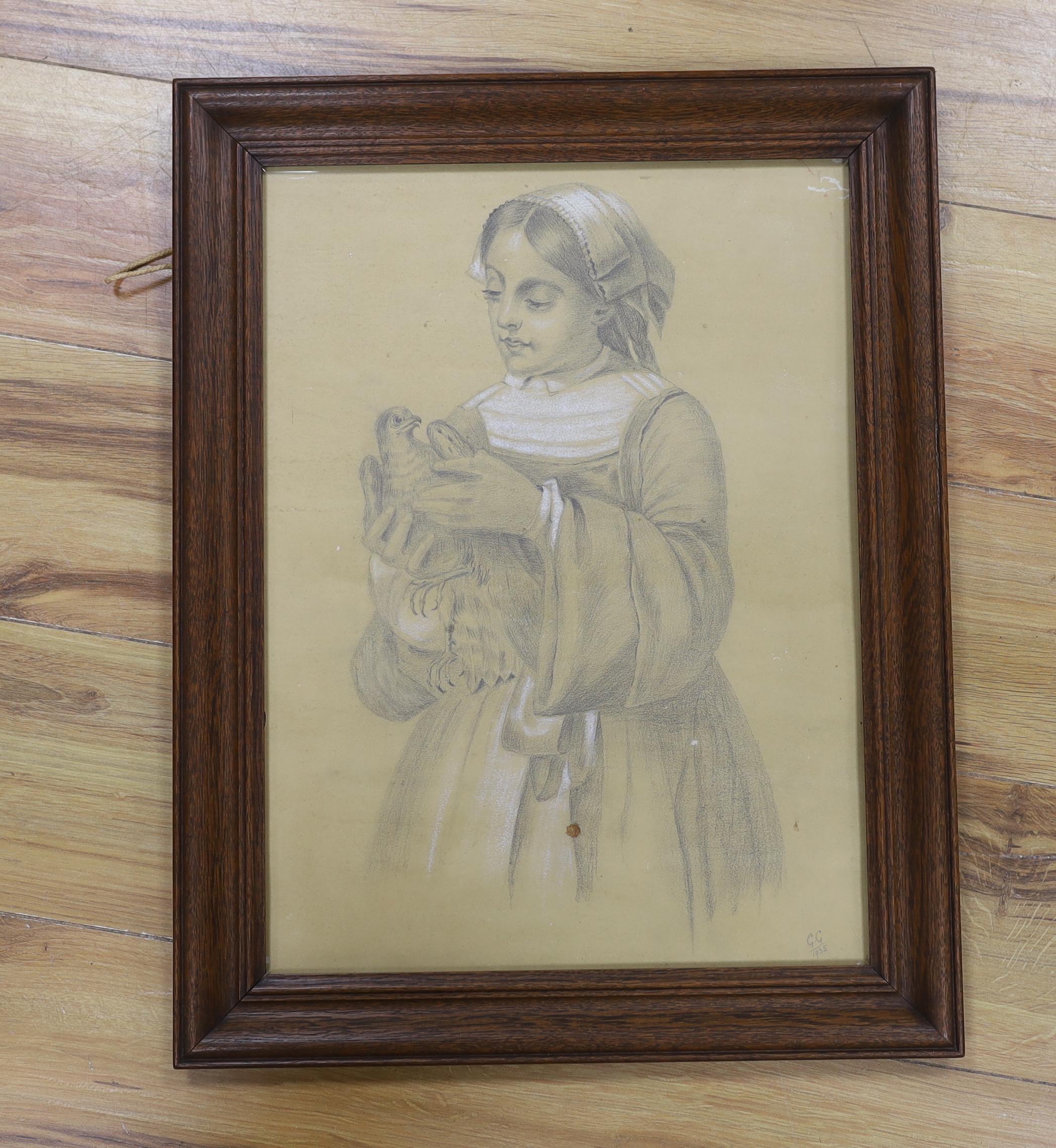 20th century School, heightened charcoal, Young girl holding a dove, monogrammed G G and dated 1935, 44 x 33cm